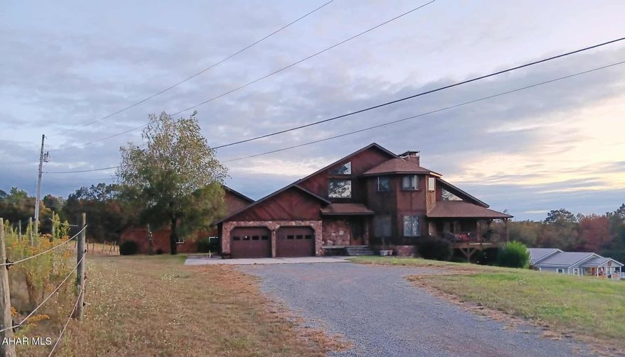 Must-See Country Retreat on 9+ Acres!

This stunning 2 to 3-bedroom home is beautifully set on over 9 acres of picturesque land with breathtaking views and room to roam. Perfect for horse lovers or those seeking a private countryside escape, this property features four fenced pasture areas and a two-story barn with horse stalls, abundant storage, and a 2-bedroom apartment with utilities—ideal for guests or rental income.

Step inside to find oak finishes throughout, an inviting open floor plan, and a spacious foyer with a grand staircase. Soaring vaulted ceilings, recessed lighting, and large windows fill the space with natural light. The heart of the home is the chef's kitchen, complete with a huge island and ample counter space, flowing effortlessly into the dining and living areas, where a double-sided fireplace adds warmth and charm.

The fully finished lower level includes ceramic tile flooring and a bonus room, office, or workout space. Enjoy year-round comfort with radiant floor heating throughout the home and garage.

Unwind on the large covered wraparound deck and soak in the serenity and views this incredible property has to offer.

Call today for more information or to schedule your private tour!