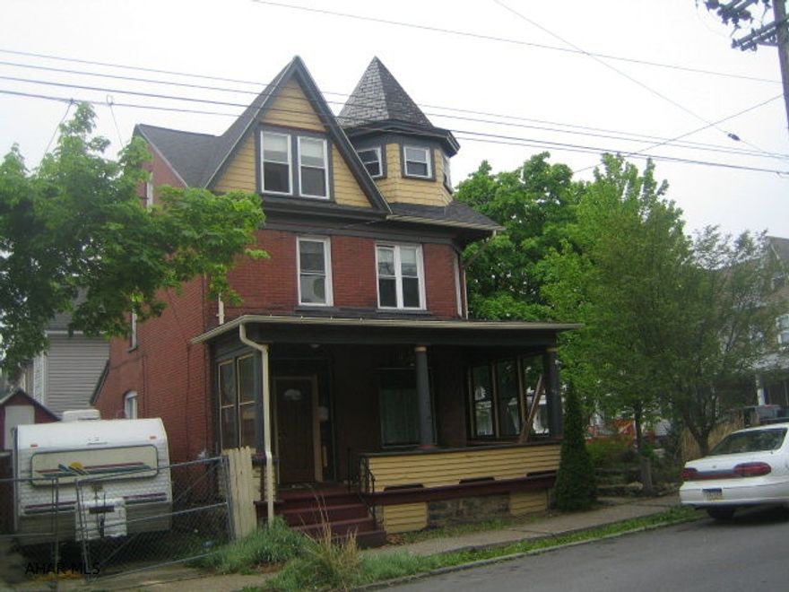 Large 2 1/2 story brick home in Juniata in need of TLC.  AS-IS sale.