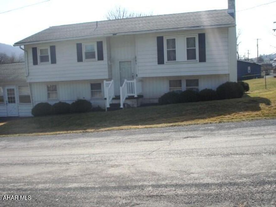 This lovely split entry home with 3 bedrooms and 1 bathroom is conveniently located to shopping, schools, restaurants and recreational facilities. The large, fenced yard offers ample opportunities for outdoor enjoyment. The two-car garage is spacious and keeps you protected from inclement weather. There is a pleasant breezeway between the garage and house as well as a sunroom on the upper level, both offering relaxation at its best.  A large laundry/mud room to help with everyday cleaning chores. The recreation room with gas fireplace and wet bar, on the lower level is a great place for entertaining.  The three bedrooms on the upper level each have large closets and ceiling fans. The kitchen offers an eat-in area and sliding doors to the sunroom. The living room off the kitchen is very pleasant and restful. This is a very sweet property with great potential. Don't miss the chance to make this home YOUR HOME!!!