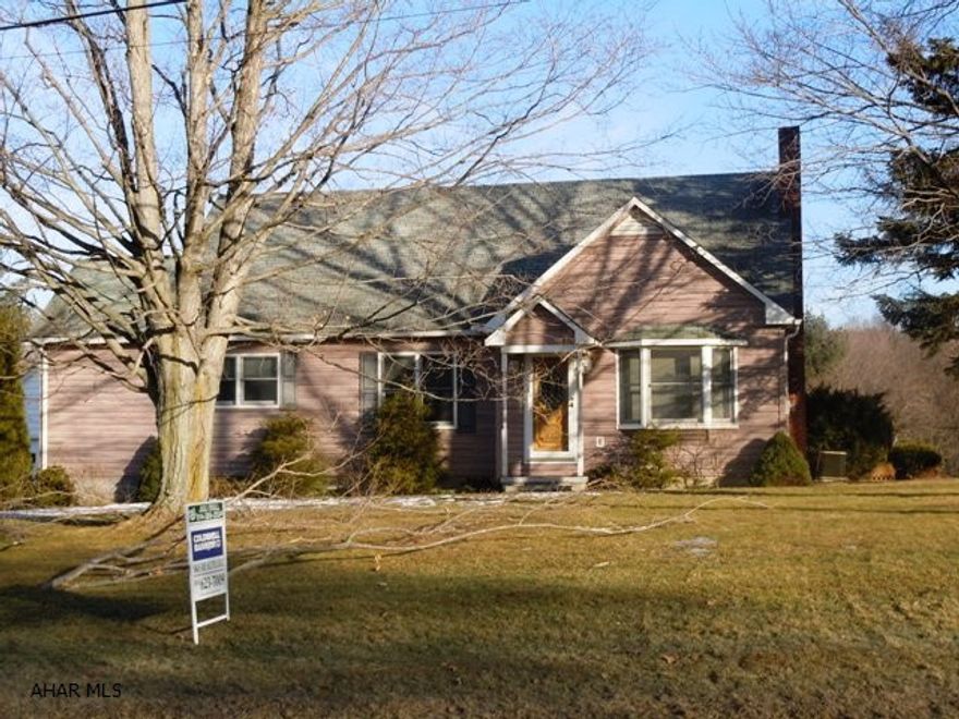 Great opportunity with this 3 bedroom, 1 1/2 bath bungalow on 1.3 acres with a detached oversize garage with electric and water. Formal dining room w/hardwood floors, kitchen w/island, oak cabinets, cathedral ceiling, skylight. Two first floor bedrooms, one exiting to a deck. Large back deck, walk-out basement. Nice buy!