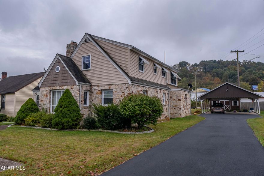 Welcome to this spacious 4-bedroom, 2-bath home located in the desirable Smithfield section of Huntingdon. Boasting a charming blend of stone and vinyl exterior, this home offers both curb appeal and comfort with off-street parking under a convenient carport and additional storage in the backyard shed. Step inside the main level to find a warm and inviting layout featuring a bright kitchen, dedicated dining room, cozy living room with a fireplace, sunroom filled with natural light, two generously sized bedrooms, and a full bath. The upper level has its own private exterior entrance, making it ideal for multigenerational living or potential rental use. Upstairs includes a kitchenette, two more bedrooms, a full bath, and a second living room, offering flexibility and privacy. Whether you're looking for space to grow or a home with income potential, this property checks all the boxes. Check out our Matterport 3D tour and schedule your private showing today!