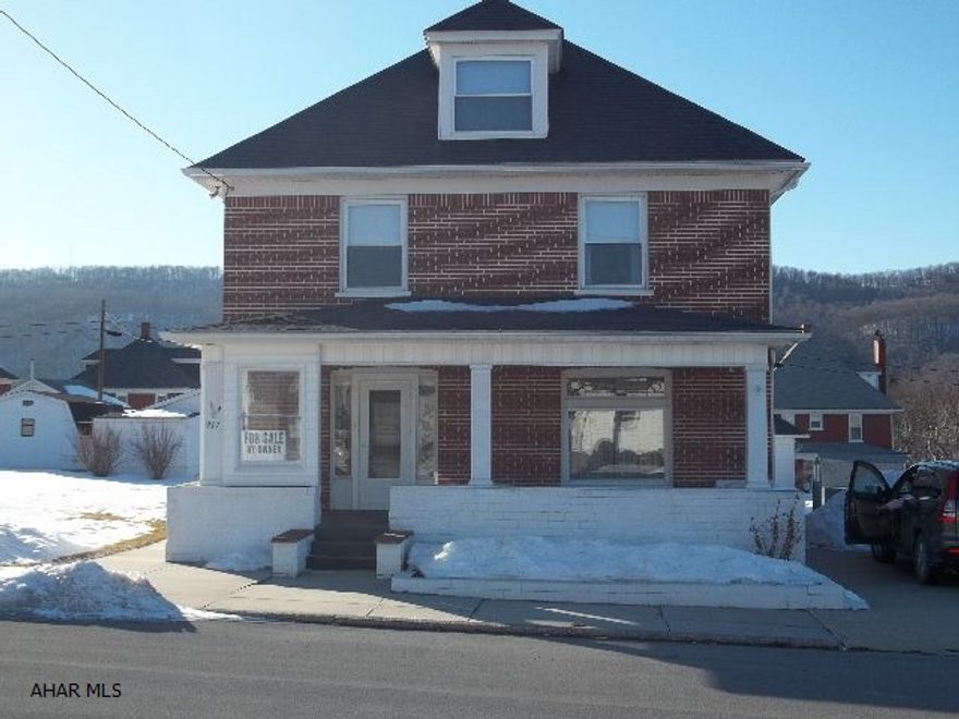 Absolutely move in ready brick  home with all the character you would expect in an older home, but with a larger modern kitchen, central air, super large deck, nice front porch, double lot, off street parking in the front and the rear with TWO detached garages, concrete drive - has to be seen! Eligible for USDA - Rural Housing Loan