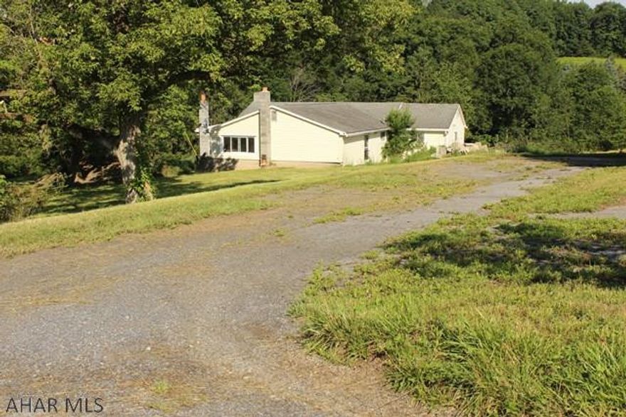 This house is in the Chestnut Ridge School District, with 8.16 acres, which sits back in a quiet country setting.  The rural view is spectacular.  Shopping near by, 15mins away from Historic Downtown Bedford.   This fixer upper is tucked away in a lovely area, and will need a rehab loan.  It's a must see.