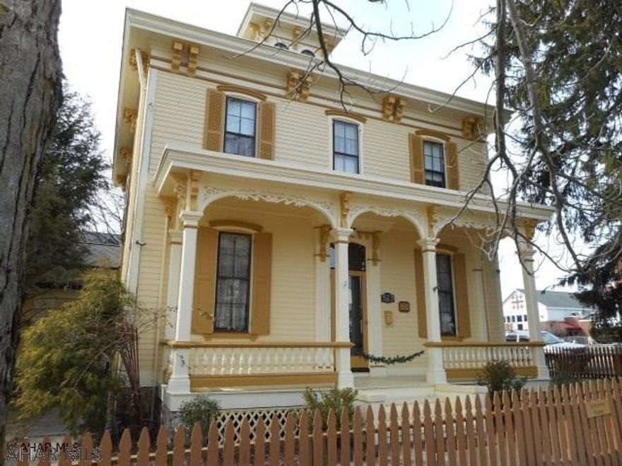 Lovely Historic home built in 1869 of Italianate architecture with cupola in the heart of the Borough. You have an Historic home with modern amenities. Original hardwood & pine floors. Updated kitchen with pine cabinetry, ss. appliances and pergo floors. Large, bright  Great room with fireplace. lst floor laundry. Den with built-in shelves and a  sep. entrance - great for a home office. Entry hall with front and back staircases.  Exterior professionally painted. Two furnaces provide extremely low heat bills. Fenced in yard. This home is situated on a corner lot with an additional lot (519 Wayne St. rear 30x30). In the Spring you can appreciate the beautiful garden/grounds.Walking distance to downtown, churches and restaurants. This is a ONE-OF-A Kind home. See Virtual Tour.