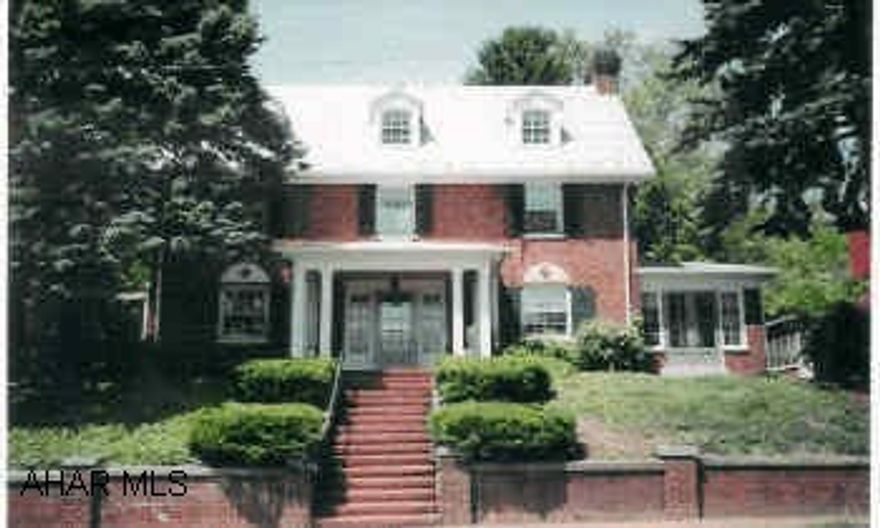 Beautiful 3-story Brick Georgian Style Home w/6BR/3BA, formal living rom with fireplace, formal dining room w/French Doors, corner china closet, curved staircase, master suite w/BA,  w/hardwood floors, period molding, grand foyer. Lot includes perennial gardens and 2-car garage w/finished upstairs.