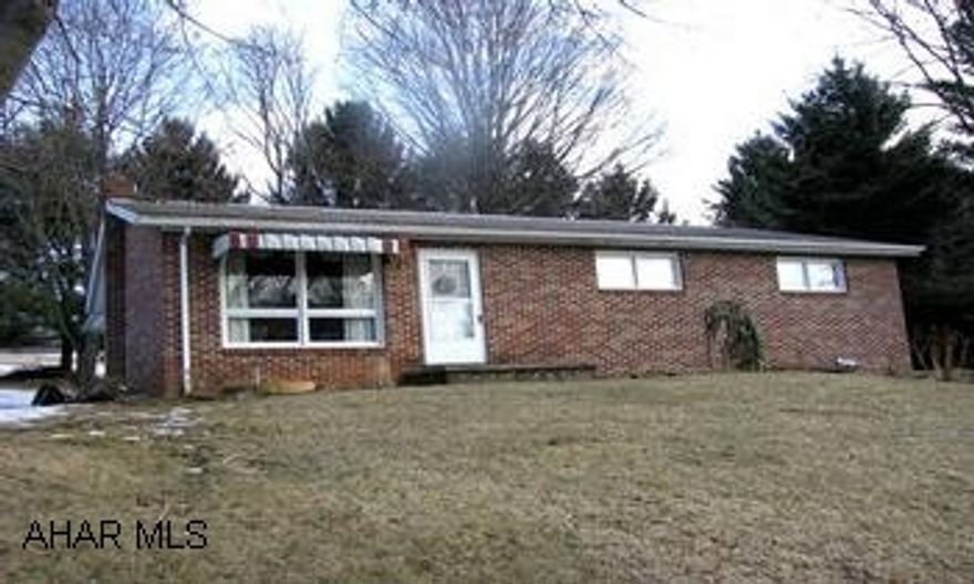 Brick, 3 BR rancher on 1.319 acres. Freshly painted woodwork and kitchen cabinets refinished. Hardwood and linoleum floors. One car integral garage. Very clean home that shows very well. Fishing stream directly across from the property. Room to expand on this 1.319 acre property. This is country living at it's best.