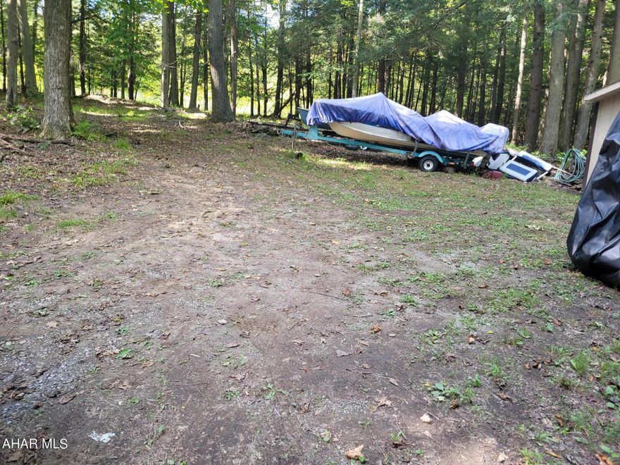 Spacious, wooded, private campsite.  Creek below.

Property Owners fees are $625.00 for the year billed in three installments.