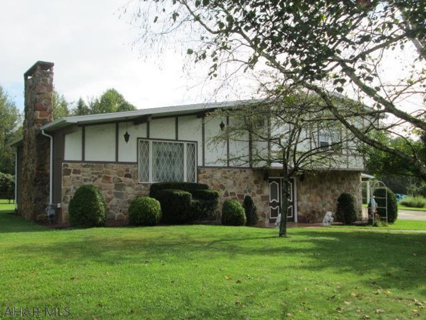 Custom built multi level house featuring two full kitchens, large living room with fireplace and family room with gas fireplace.  The house sits on a large, flat, 0.95 Acre lot.  The detached 3 car garage features a workshop and fenced rear garden area