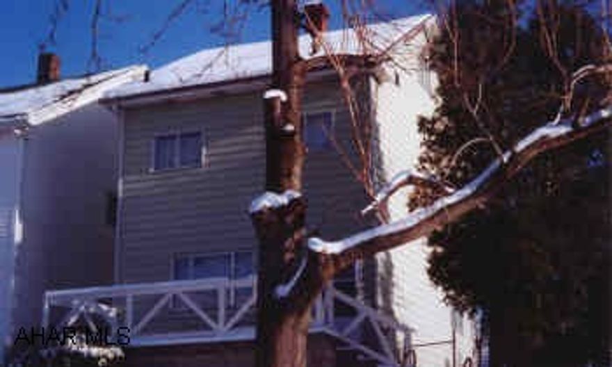 2.5 story aluminum sided home.  Shingle roof, 100AMP electric.  Needs some TLC.