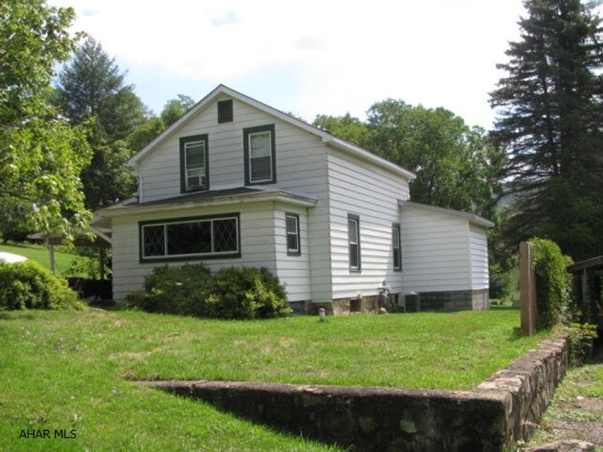 Don't miss your chance to own this updated Tyrone home on over half an acre!  This home offers a LR, DR, Bonus room, EIK, Mudroom and bath all on 1st flr!  2 bedrooms and updated bath on 2nd floor!  1st flr laundry, new Central AC, porch & flooring!  All on a large lot with fruit trees, grape vines and lots of room to garden!!  Carport and detached 1 car garage complete this home on a quiet street!