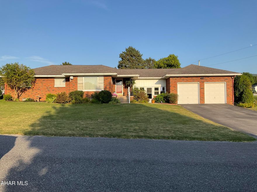 Welcome Home. This Lovely Brick Ranch style home in a rural setting yet close to Shopping, Doctors and Peaceful Country Living is Move In Ready to make it your own. Nestled on .37 acres, Corner Lot. This home offers Hardwood Flooring, an Updated Kitchen with Granite Counter Tops, Custom Cabinetry w/pull out shelves. The Formal Dining Room has French Doors leading out to a low maintanence Deck. Central Air welcomes you on hot summer days and nights. 3 spacious bedrooms offer a restful nights sleep. The Breezeway between the Garage and the house is additional living space that offers a Quiet Spot to unwind or entertain, enjoy Summer Days & Nights and all 4 seasons to the soft falling snow while the Pellet stove keeps you cozy and warm. The Over Sized 2 Car Garage is perfect for your Vehicles, and storage for your recreational Toys & Lawn equipment. Also this home offers a unique feature...a Summer Kitchen for canning your harvest! The Full Size Basement with high ceilings is waiting for your personal designs. Weather you are downsizing or raising a family, this house will suit all of your needs. Call for your Exclusive Tour Today.