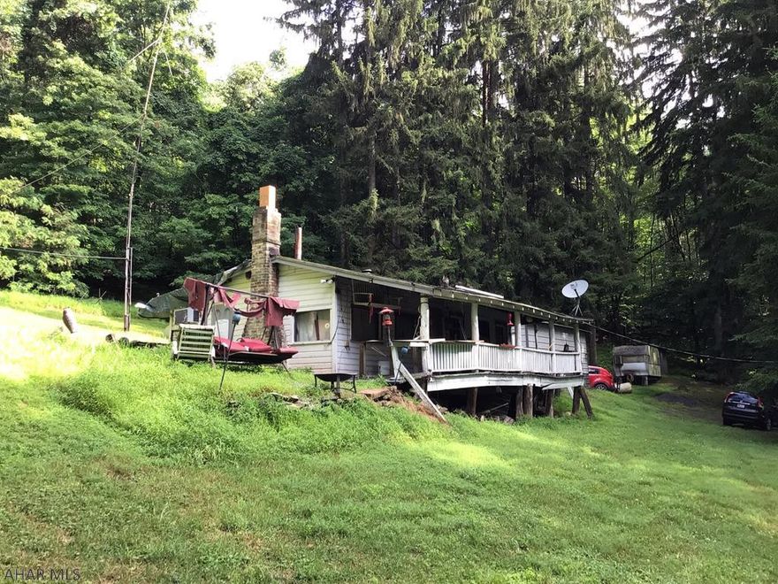 Private 26 acres close to Blue Knob!  Perfect spot to put your own get a way but still close to everything.  Power to property and newer well but septic condition and location is unknown and a large 20'x25'garage.