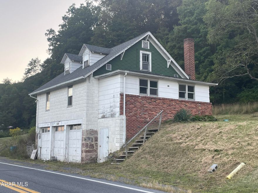 1.5 story, 2 BR, 3/4 BA home with a full basement and 3-bay integral garage. Located just south of the Bedford Springs Resort with great scenic views. Beautifully refinished cherry hardwood floors, Freshly cleaned and painted interior. situated on 1.29 acres. off road parking also you can park in the back of house  entering neighbors driveway. recorded right away agreement.