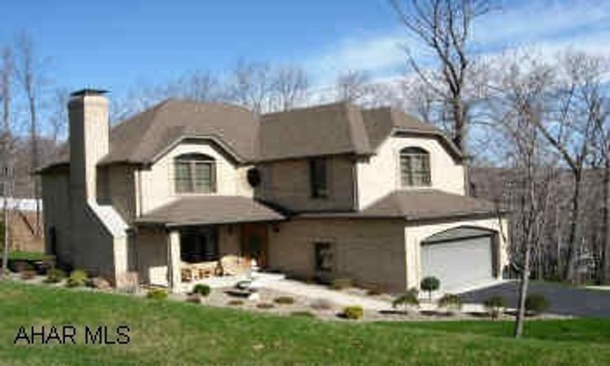 LOWER LEVEL CAN BE USED AS A MOTHER-IN-LAW SUITE WITH A SEPARATE ENTRANCE.  EXTREMELY LOW TAXES (LOGAN TWP) HOME WARRANTY PROVIDED.  LOVELY KITCHEN WITH CENTER ISLAND AND TILE FLOOR.   ALL BRICK. ANDERSON ARCHED WINDOWS. FOUNDATION IS 12 INCH BLOCK CONSTRUCTION.