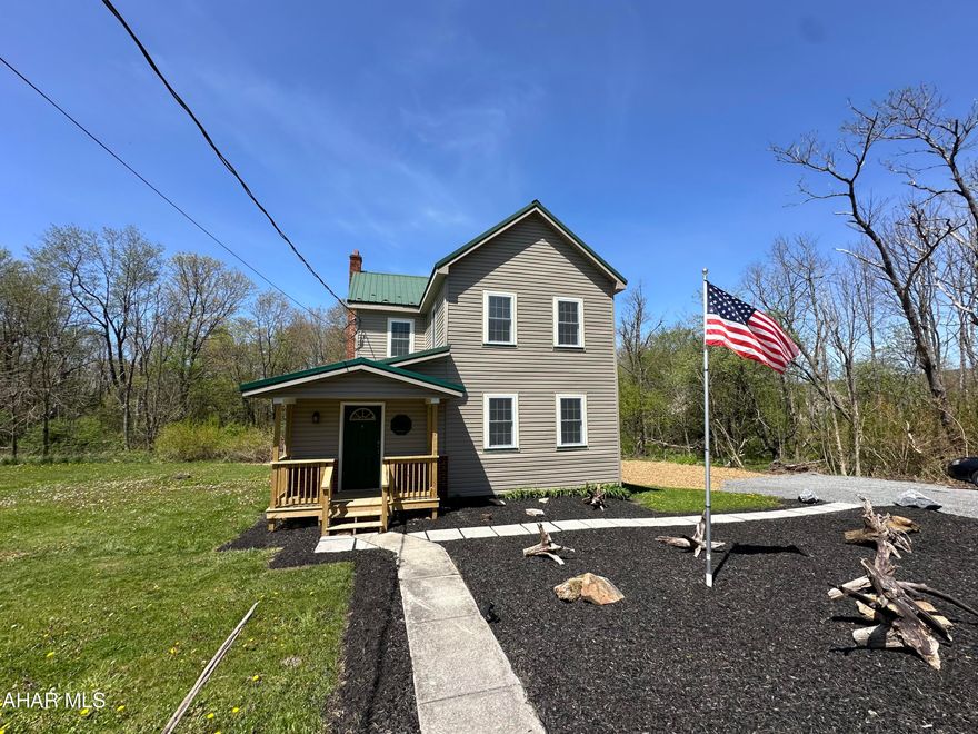 Hollidaysburg School District- Beautifully remodeled farmhouse with  over 26 acres, new kitchen, main floor half bath, laundry is on second floor, freshly painted, new flooring, new decks, ready to move into, new septic tank