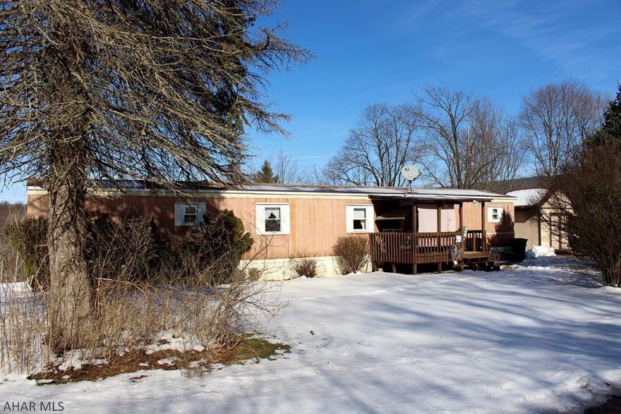 Cozy two bedroom, two full bath home in the private Hillcrest Estate community.  Bedrooms are on separate ends of the home.  This home is very well kept and maintained.  Newer furnace and hot water tank!  Features include a large driveway, shed, covered front porch, and rear deck. Lot rent of $297 includes water, sewer, snow removal, and trash pickup.