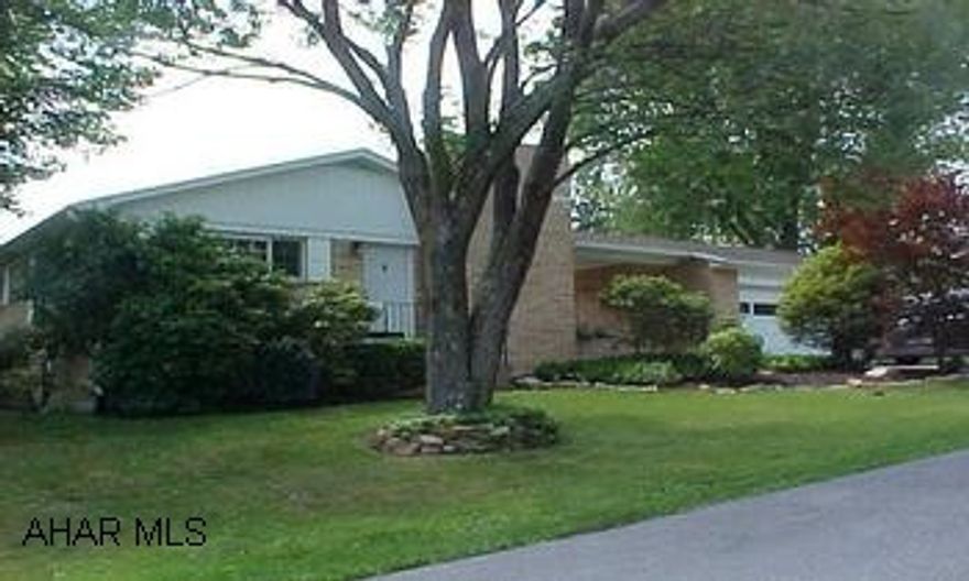 Charming, One Story Living - Convenient Location - Many Updates! Large open kitchen (Woodmode Cabinets), Dining area with fireplace, New appliances, Finished basement.  New furnace, air, hotwater tank, roof '04, gutters, windows.  Freshly painted - Breezeway covered.