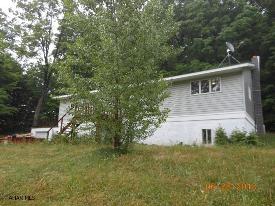 This is a lovely home in Northern Cambria School Distirct. It has a very nice kitchen with attached dining room. This home features three bedrooms with new carpet. The master bedroom has its own master bath-jacuzzi tub with tiled splash and shower. Large living room. The basement is large and unfinished. A deck for entertaining off the side of the home. 2 car attached garage with entry into the basement. Rural secluded area. Large 4.1 acre lot.