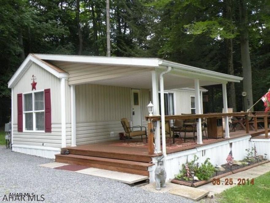Well maintained park model on 2 lots, Sit on the deck in the sun or move to either end under the roof. Fully furnished including gas grill, deck furniture and mower, shed