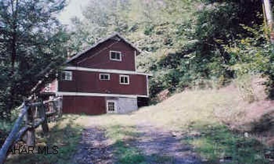 Two story contemporary with 7 rooms, 2BR,  2.5 Baths, unfinished interior. Has great potential. Unparalleled views.