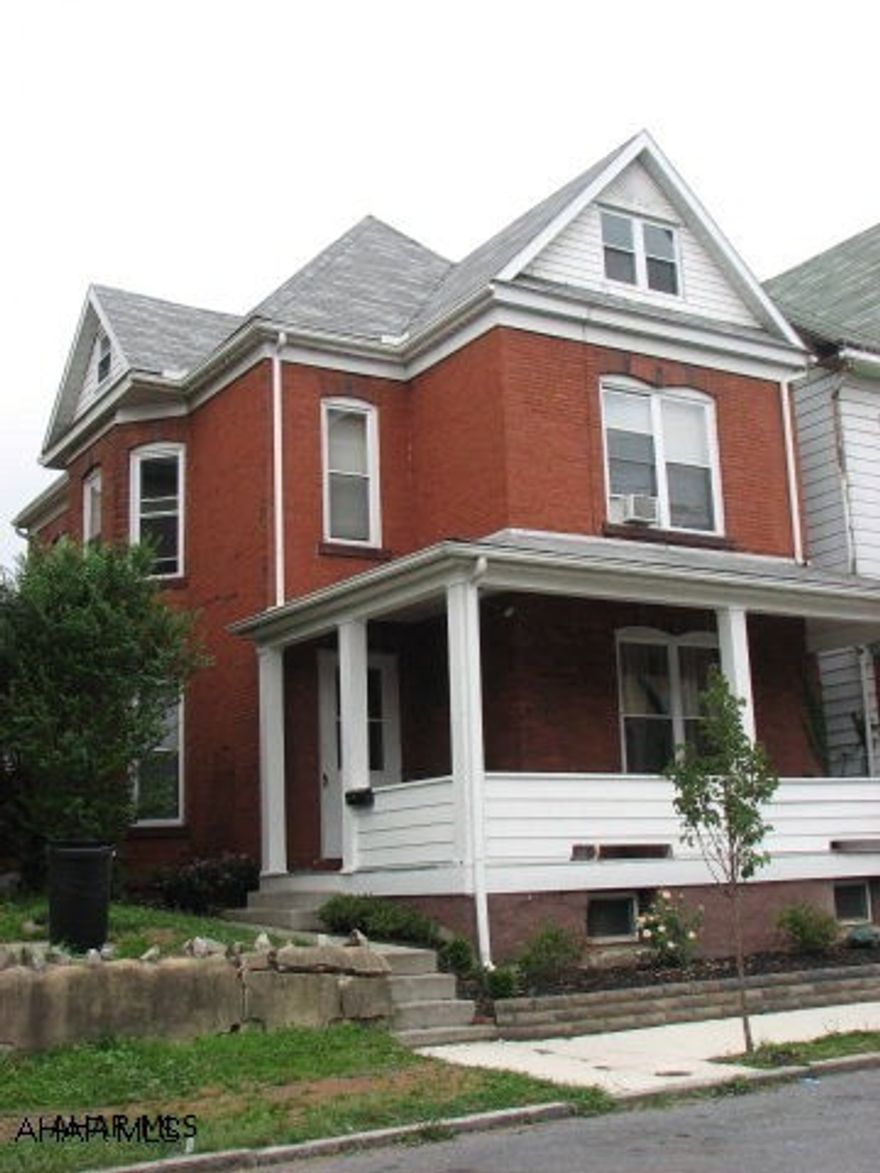 3 Story Brick Victorian Style Home.  Newer kitchen, stainless steel appliances, laminate and ceramic floors.  Very large spacious rooms.  Nice fenced in yard.  Short walk to Wright School.