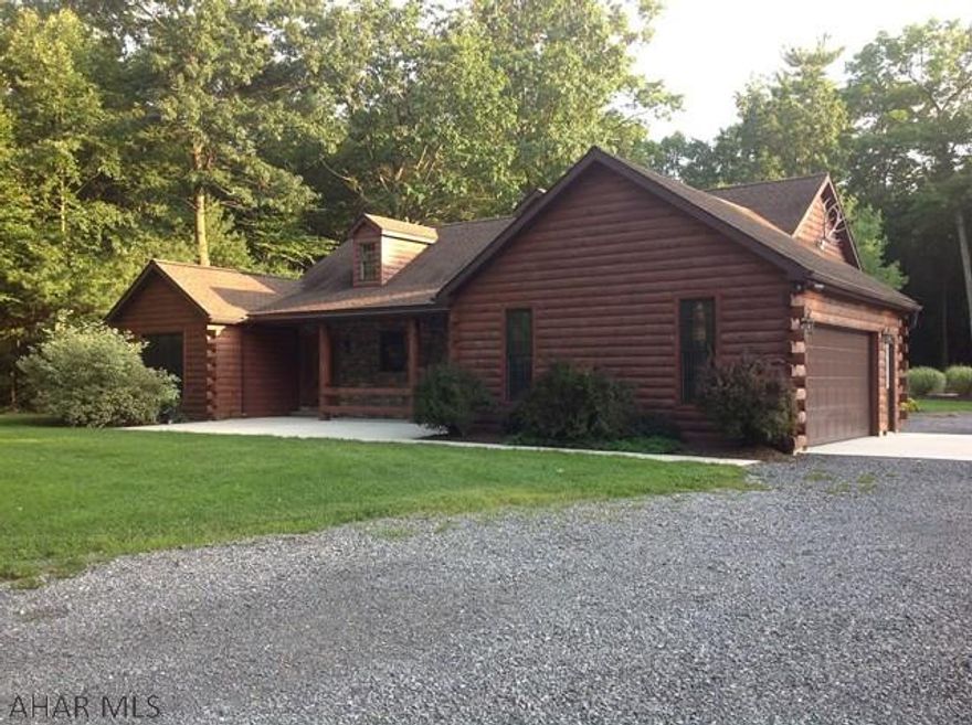 This beautifully landscaped property is only 5.4 miles from Historical Downtown Bedford. This peaceful property not only is quiet and private but has a beautiful and  spacious 3 bedroom  log home with  two very large garages / barns for not only the men's collection of toys , but the ladies can have their toys as well !!!!  Also, large garage / building could also be aa business if so desired.  With 36 acres , this property has an abundant wildlife for admiring or hunting.  It has everything that a lady of the house would want and just what the gentleman is looking for.  Please don't miss this great property.