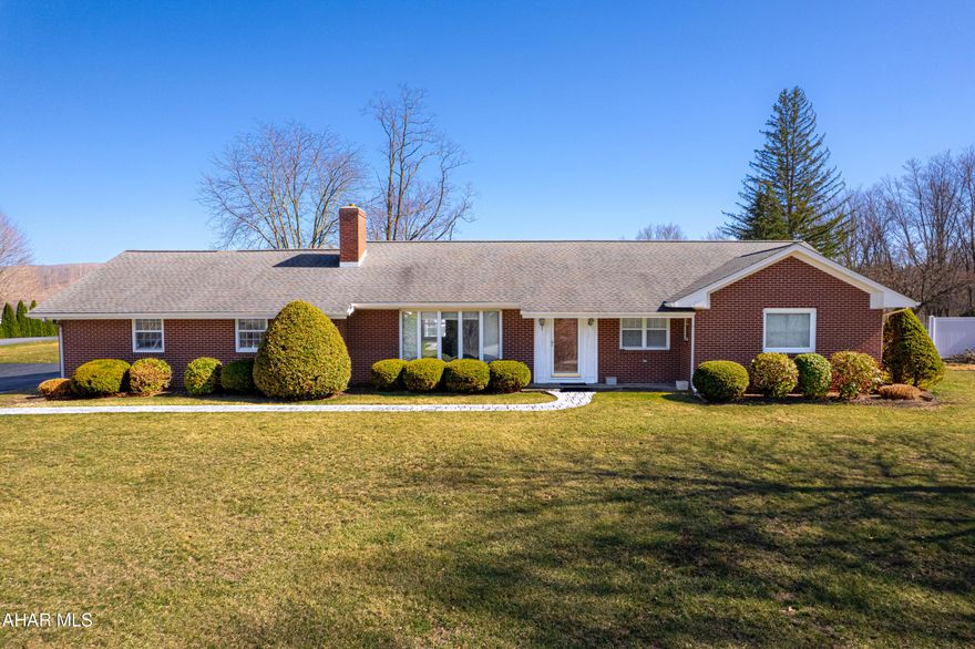 Welcome to this charming brick ranch home in the heart of Bedford, PA!! Just minutes from the downtown area but offering beautiful mountain views and a large 1.557 acre lot. The spacious main house features three bedrooms and two full bathrooms, large kitchen with pantry, a bright living room with a wood burning fireplace, dining area great for dinners and guests, and a convenient first floor laundry room. Finished basement with a large rec room and another wood burning fireplace. There is an unfinished portion of the basement offering a kitchen area that's perfect for canning all those fresh garden vegetables and offering ample storage. Hardwood floors, wood trim, replacement windows and 200-ampere electric. Two-car garage and a paved driveway. Attached to the main house is a fabulous in-law suite or guest quarters. This section of the home offers a living room, kitchen, sunroom, full bathroom and one bedroom. Outside you will find an in-ground swimming pool for all to enjoy and have fun on those hot summer days. Quality home in a terrific location!!