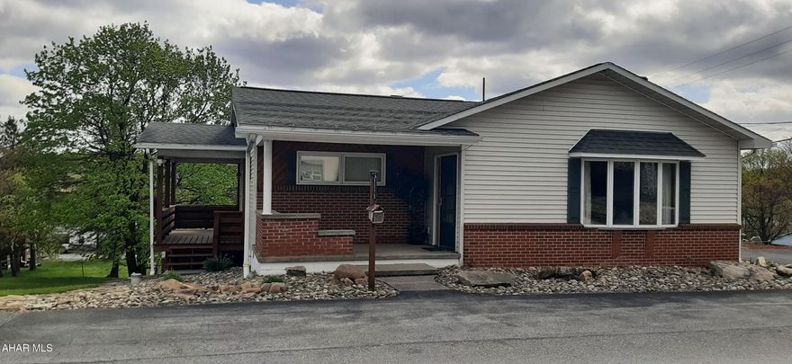 Welcome to this unique property in Coupon. These three parcels have it all! The three-bedroom, 2 bath home sits on two parcels with a private, beautiful deck overlooking the expansive backyard. The front door welcomes you to the foyer with closet, the expansive living room has some unique features including a mural, large window and real stone accent wall. The dining room is open to the well-equipped kitchen with oak cabinetry, 2 ovens and generous counter space for prepping meals or entertaining. The hall bath offers a tub/shower combo and single vanity, all with oak accents. Two comfortably sized bedrooms with ample closet space. The third bedroom could be used for an office due to the private entrance with its own covered patio. The basement houses the second bathroom, laundry and two sources of heat. One oil boiler and one self-feeding pellet boiler. This home also offers a generator hook up for added peace of mind. Beautiful landscaping on all sides of the property with multiple decks and patios to enjoy the scenery. The third parcel offers a 3-car oversized garage (30x40) with propane heat, electric and water. Also offers a loft that could be used for storage. There is an additional garage with propane heat, electric, cable, and water. This was used for a covered picnic area that connects to the pizza oven area where the outdoor kitchen was set up. Also on this parcel is a pergola with a wood burning fireplace and electric. Further out in the beautifully landscaped yard is the outhouse and another shed. Both have electric. This unique property is a must see for yourself, so you can take in all the beauty and craftsmanship that this property has to offer. Call for your private showing today!