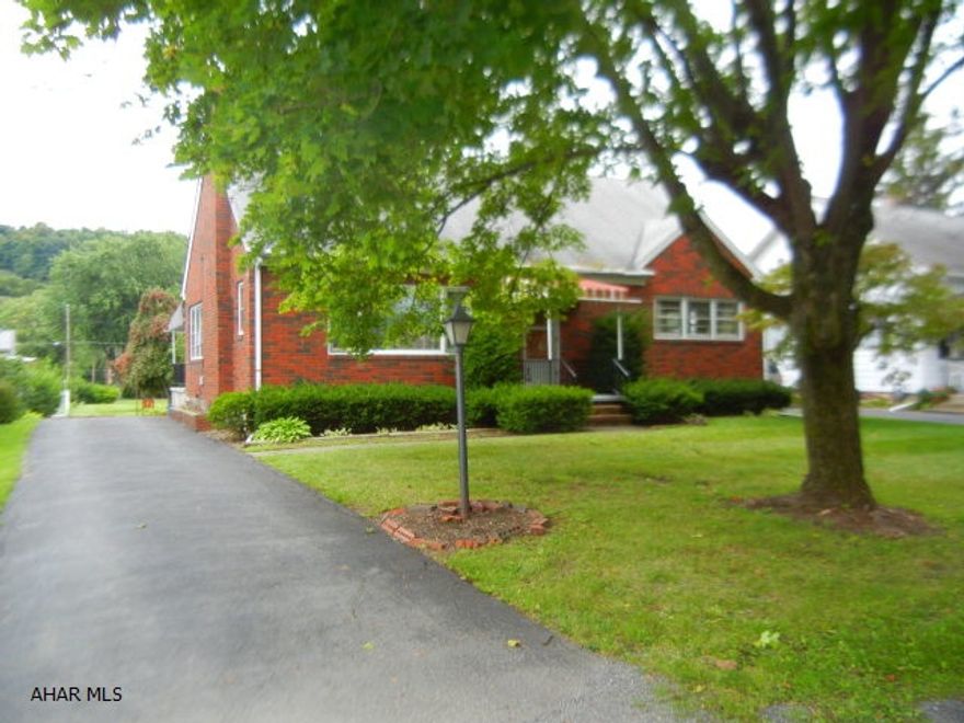 Spacious brick home in Hollidaysburg School District.  Convenient location in Eldorado area close to I-99 and shopping.  Deep lot goes through to Maryland Avenue.  Updated kitchen with breakfast bar.  Brick fireplaces in living room and family room.  Just replaced hot water tank.  Great for growing or larger family.  Agent is related to Seller.