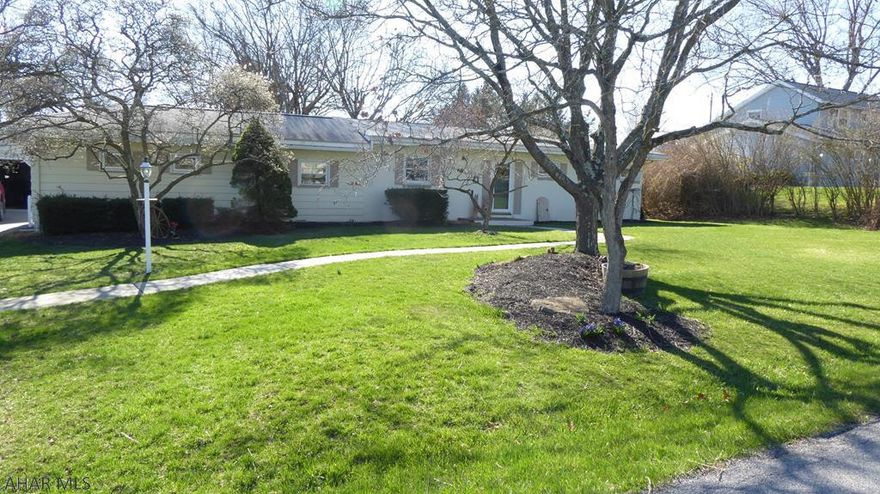 This beautiful mid-century modern ranch awaits its new owners.    Oozing with charm and character it includes an updated kitchen and dining room make entertaining easy and enjoyable.  It includes a master bedroom and bath with a soaking tub.  The large living room windows bring in the natural light and looks out to the private back yard.  2 bedrooms w/ ability for 3rd. It is complete with a detached insulated and fully equipped  2 car garage.   Come and sit on the back porch and enjoy the fenced in yard with the mature trees, watch the birds, enjoy a fire in the firepit, or just swing on the swing.  Take a walk through the neighborhood, or go to the near by Blairmont Club, the Sylvan Hills Golf course or downtown Hollidaysburg.   Close to shopping district, restaurants, and so much more.