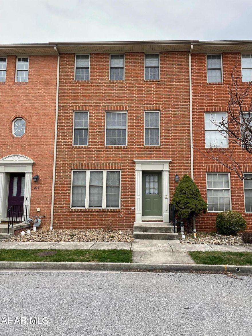 Don't miss out on this beautifully maintained townhouse in desirable Holliday Hills! Enter the main level to new, luxury vinyl floors and a living quarters that could serve as a family room or guest suite with a full bath available. Main level containing open kitchen with new appliances (air fryer oven!). Open living room and dining room area offers beautiful hardwood floors with a half bath completing the main level. Both bedrooms include large closets, and full bath contains pocket door and plenty of storage. Convenient laundry chutes on main and second floor. Central air and off street parking. The Holliday Hill townhouses offer a playground and picnic area perfect for spending time outside! Call today for your private showing before it's too late!