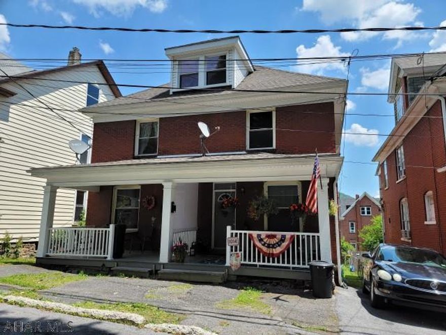 2 1/2 story brick double house with 3 bedroom each side. All separate utilities. Appears to be an access right-of-way along the southern property line