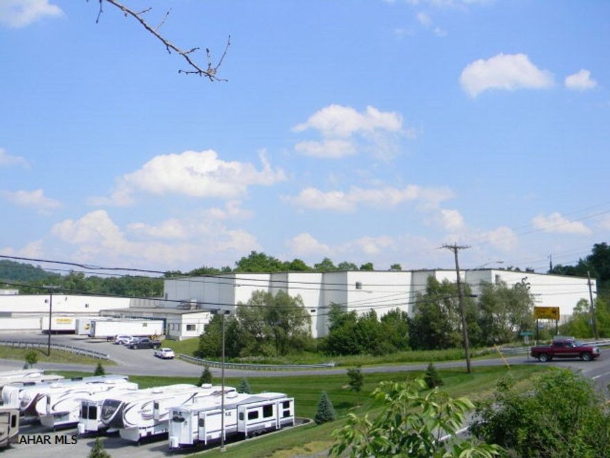 221,000 sq. ft. manufacturing and warehouse building. 3,500 sq. ft. of office space, up to 22' clear ceiling height, 21 dock & overhead drive through doors & 4,000 ampere electric. Three phase electric, natural gas, public water & public sewer. 10.632 acres, 1 mile to Interstate 99 and less than two miles to PA Turnpike.