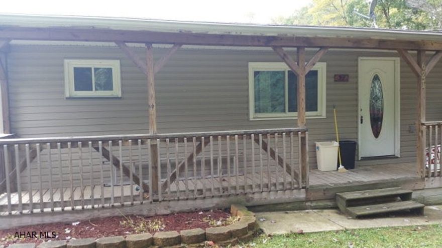 Huge Master bedroom with fireplace, small kitchen, house has many possibilities, furnished basement with bar, and newly remodeled bathrooms.