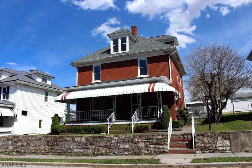This is a completely updated brick home in Roaring Spring!  The home is situated on the hill near the athletic field.  The interior of the home features freshly painted walls, ceilings, and woodwork.  The home has a newer (3-year-old) roof, new windows, and new flooring throughout.  The kitchen has all new countertops, cherry cabinets, and includes appliances. There is a laundry room on the main level with included washer and dryer.  The main level powder room has been completely remodeled as well.  The second floor has 4 bedrooms and a remodeled full bath with a double bowl vanity.  The third floor has a bonus room. Other property features include a fenced yard, inground pool with new liner, grilling and eating area on the pool level, and a detached garage and carport with alley access.