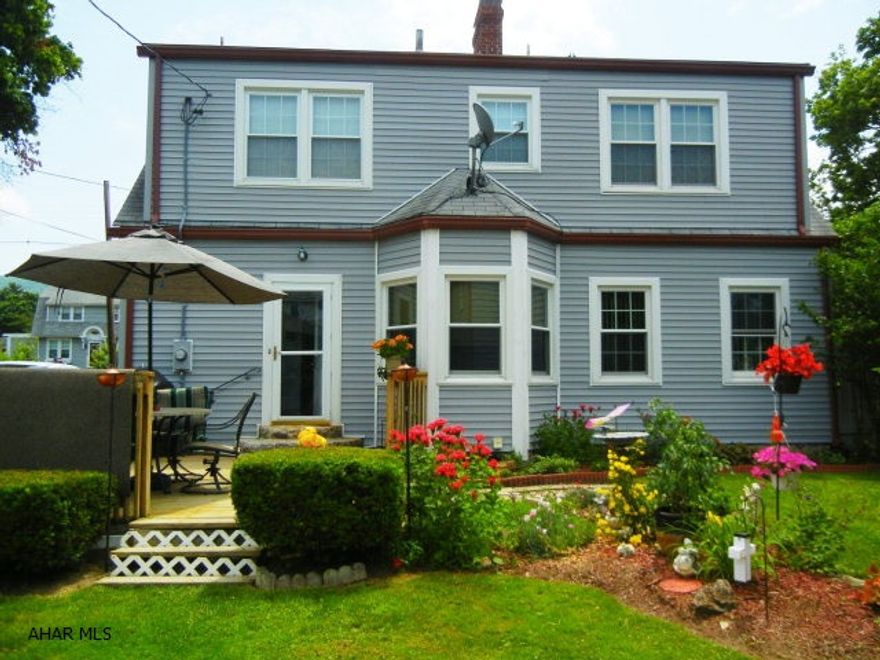 CHARMING AND PRISTINE!  LARGER THAN IT LOOKS! Walk to Bishop Gilfoyle! 3 bed, one on 1st floor with 1/2 bath can also be used as a den/office.  2 large 13x25 bedrooms on 2nd floor with walk in closets and storage.  2 fireplaces, 1 gas and 1 wood.  Original hardwood floors, woodwork and builtins throughout.  Large basement has a man cave family room with wood fireplace and a large laundry/utility/storage area.  New siding, doors, windows and countertop.  HUGE detached 2 story 2+ car garage has second floor partially finished and insulated for work area or extra living with separate electric installed. Gas, water ready for buyer hook up. Lawn and gardens are fenced for privacy and security.   Close to schools, shopping, interstate highways and public transportation!  Home Warranty!