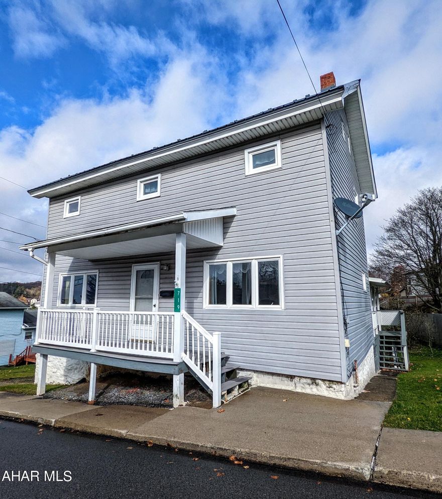 Penn Cambria Schools! FIVE bedrooms, TWO bathrooms, huge kitchen, with a deep yard. Grey siding, metal roof, and cute front porch for curb appeal, plus a covered deck off the kitchen for easy outdoor dining and backyard access. Spacious downstairs living spaces are ready to be filled with people for holiday gatherings. Radiant hot water heat, off street parking. Seller will provide sewer compliance.