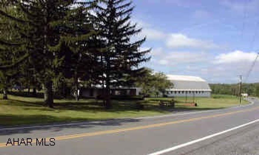 Approx. 90 acres - about 1/2 tillable.  Part of property is on S. side of New Rt. 22.  Mostly level.  Includes barn, milkhouse/store, 2 silos, 2 story house, 2 car garage, large shed.  Currently receives rental income from billboard. Excellent location for commercial development or subdivision. Good access via Rt. 53 to Admiral Peary Hwy. with frontage on Rt. 22.  Natural gas and public water to property.  Farmland currently rented annually.  Access fee for 2 gas meters.  Borders Mt. Aloysius College.  Just outside Cresson on way to Ebensburg.