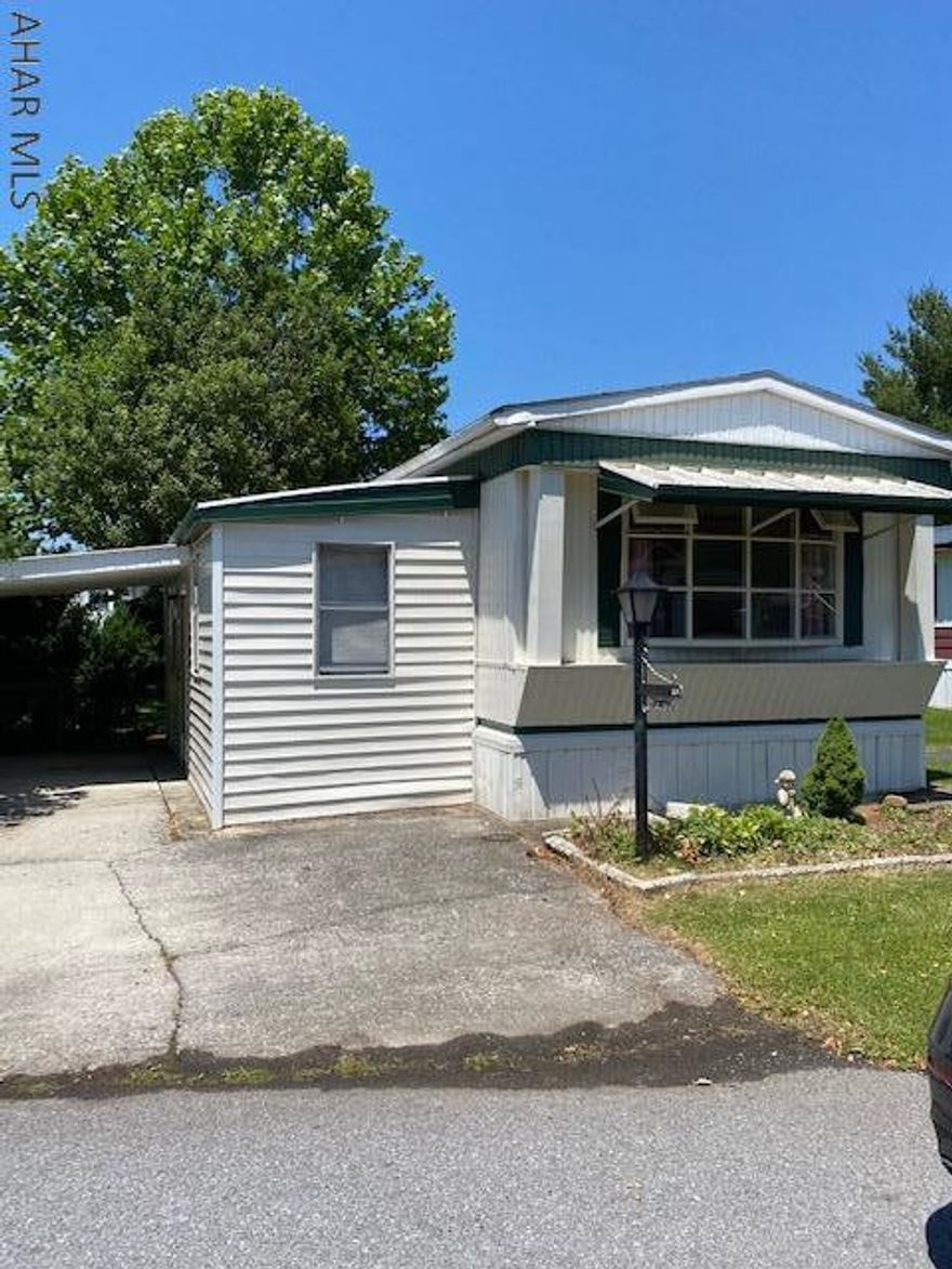 Well maintained, 2 bedroom, 1 full bath in Eldorado Mobile Home Court 55+. New laminate flooring throughout, additional enclosed side porch, carport, newer furnace, awnings.