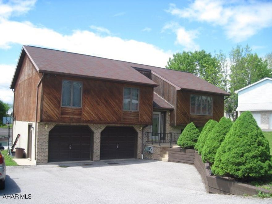 Nice Cedar Sided Bi-Level On 90' x 158' Lot - Cathedral Ceilings - Skylights - Family Room In Basement - Office Or Exercise Room - 2 Car Garage - Central Air - Beautiful View.