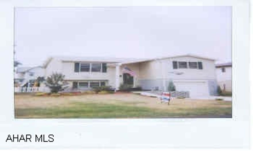 Maintenance free, flat level lot, newer bi-level, built in 1998.  3 BD, 2 decks, above ground pool, oak cabinets, central air, FR, w/wet bar, beautiful landscaping, vinyl fence.