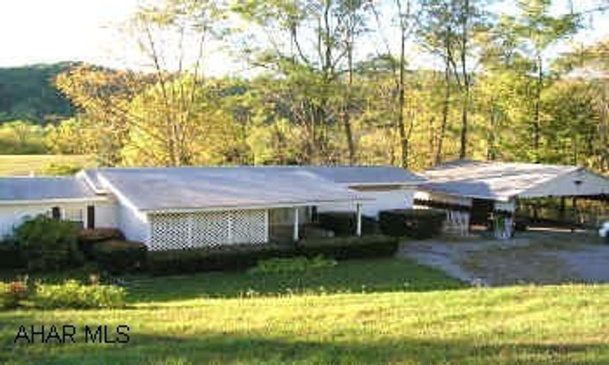 FRESHLY PAINTED HOME WITH LARGE CARPORT.  BEAUTIFUL PIECE OF GROUND.
