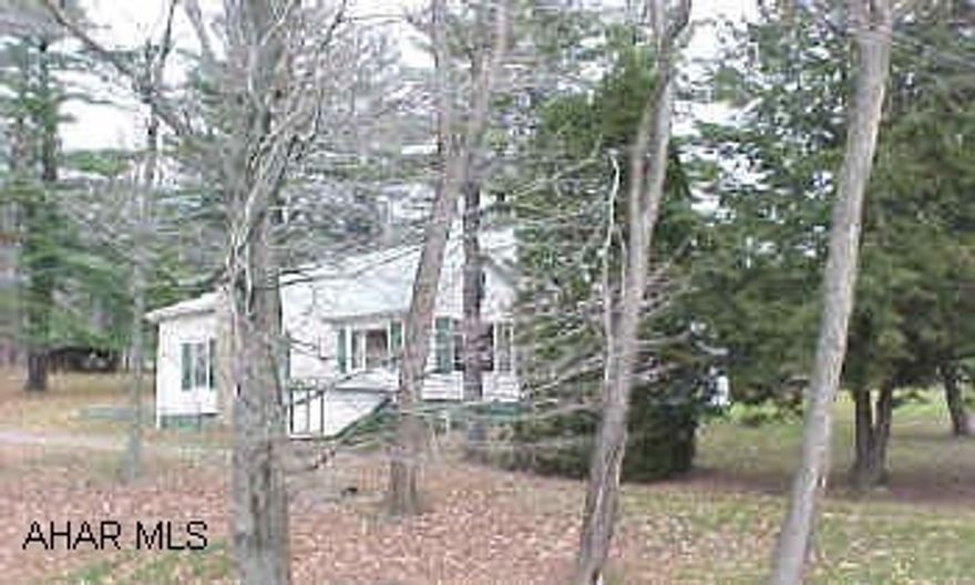 Super location! Over 2 acres of ground - cute bungalow-bigger than it looks! Water source is from spring - buyer will probably have to dig a well. Detached garage has fire damage. Sold "as is". Super location! Over 2 acres of ground - cute bungalow-bigger than it looks! Water source is from spring - buyer will probably have to dig a well. Detached garage has fire damage. Sold "as is".  Sun Room - Horses OK