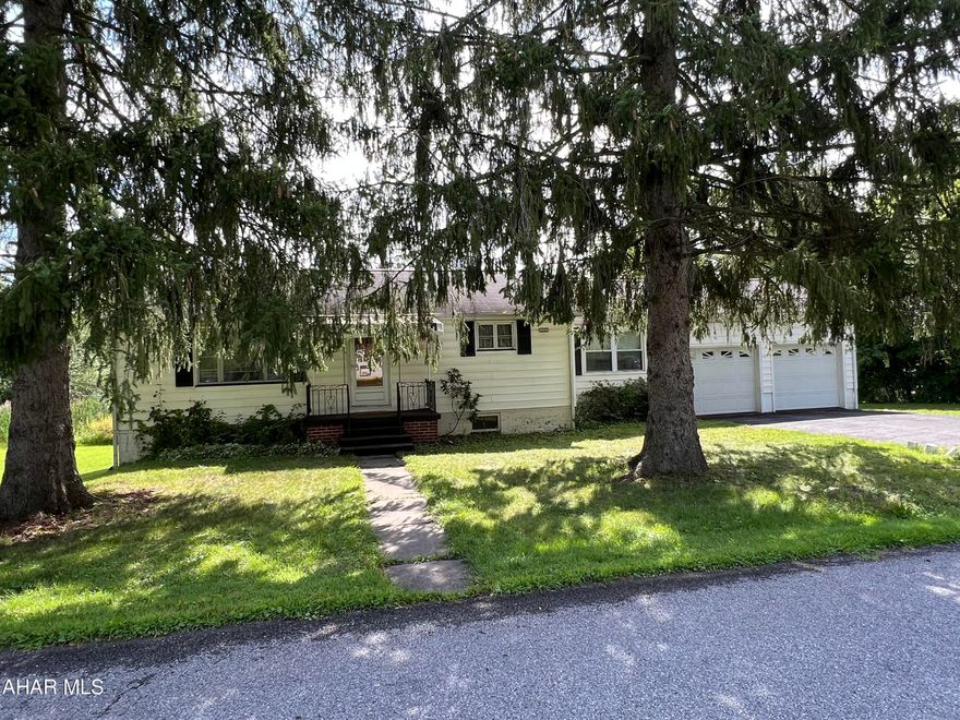 Adorable One story home in Logan Township. Two bedroom home with nice kitchen, large family room with hardwood floors and 2 car garage. This property is situated on 6 parcels. Call for a personal tour.