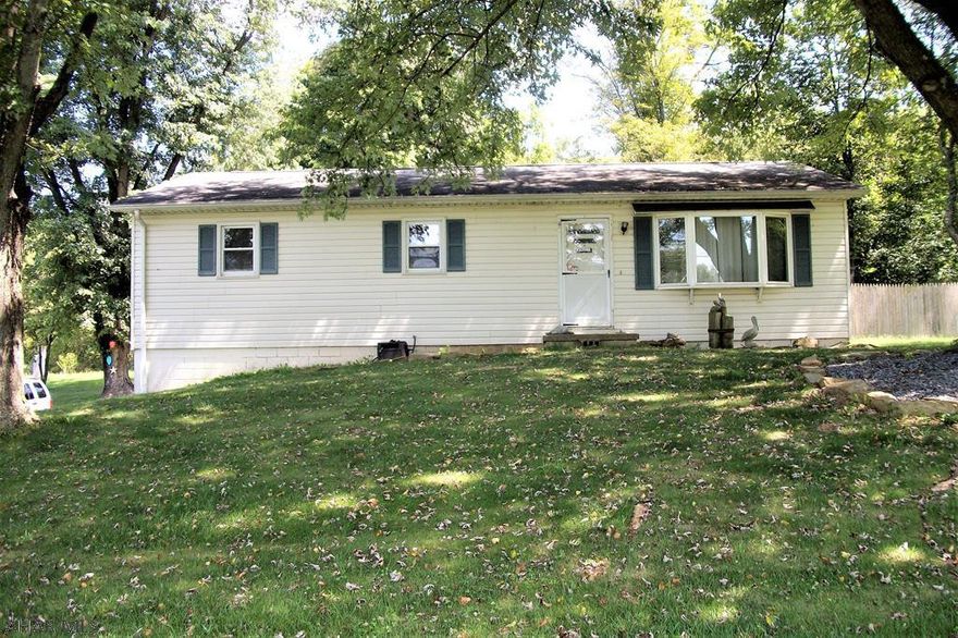 Enjoy the serenity of country living in this 3 bedroom, 1-1/2 bath ranch home. This home features a large kitchen with a dining area, a generous living room, a partially finished basement and almost 3/4 of an acre of fairly level land. Mature trees in the front yard provide shade in the summer. It has a convenient, one-car integral garage. Located minutes from downtown Bedford, the PA Trunpike and Interstate 99.