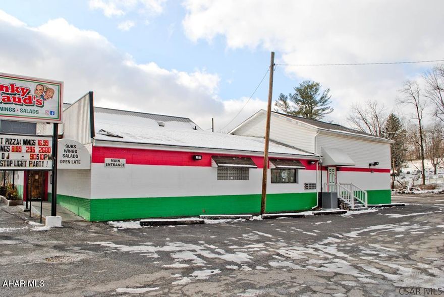 Sitting on 1.07 acres and located on a high traffic road this well established business is ready for its next owner. With a Hotel liquor license included in the sale, it allows for current operations as a bar/restaurant as well as promotions and live events. There is a spacious dance floor, a stage, VIP area, bar and pool room. There is a fully equiped kitchen and main bar and side bar that glows!! There is ample parking in the private lot. There is also 5 boarding room for additional monthly income. For the entrepreneurial minded this is your next quality investment. After decades of successful service this well known turnkey business comes with all the equipment to continue to be successful. Call listing agent today for more information and to schedule your private tour.