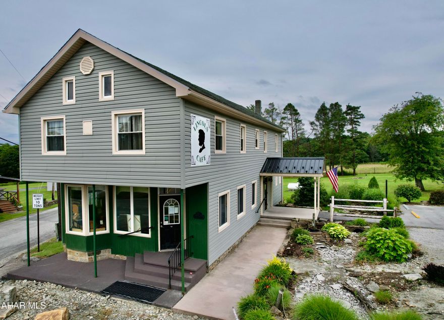 LOCATION, LOCATION, LOCATION.  Just 1.5 miles East of the Flight 93 Memorial National Park entrance along the historic Lincoln Highway where hundreds of thousands of visitors come each year to visit, sits a profitable turn key business. Patrons from all over the world have enjoyed the food and atmosphere in the historic café.  This was once Buckstown's General Store and Post Office(which is still hanging inside the café today).  Large store front windows allow for tons of natural light in the dining area.  Patrons can sit and relax after visiting the Flight 93 Crash site and take in the horses from the nearby campground or the windmills across the street.  The café seats 50 comfortably inside with additional seating outside on the picnic tables if traveling with pets.  The manicured 1.5 acre corner lot with a shed and 2-car garage allows for expansion of endless possibilities. Vegetable/fruit/flower stand outdoors while patrons can take a break inside the café.  There is also an open BBQ pit covered by a aluminum roof at the back of the building.  The upstairs is an apartment with a shared office space.