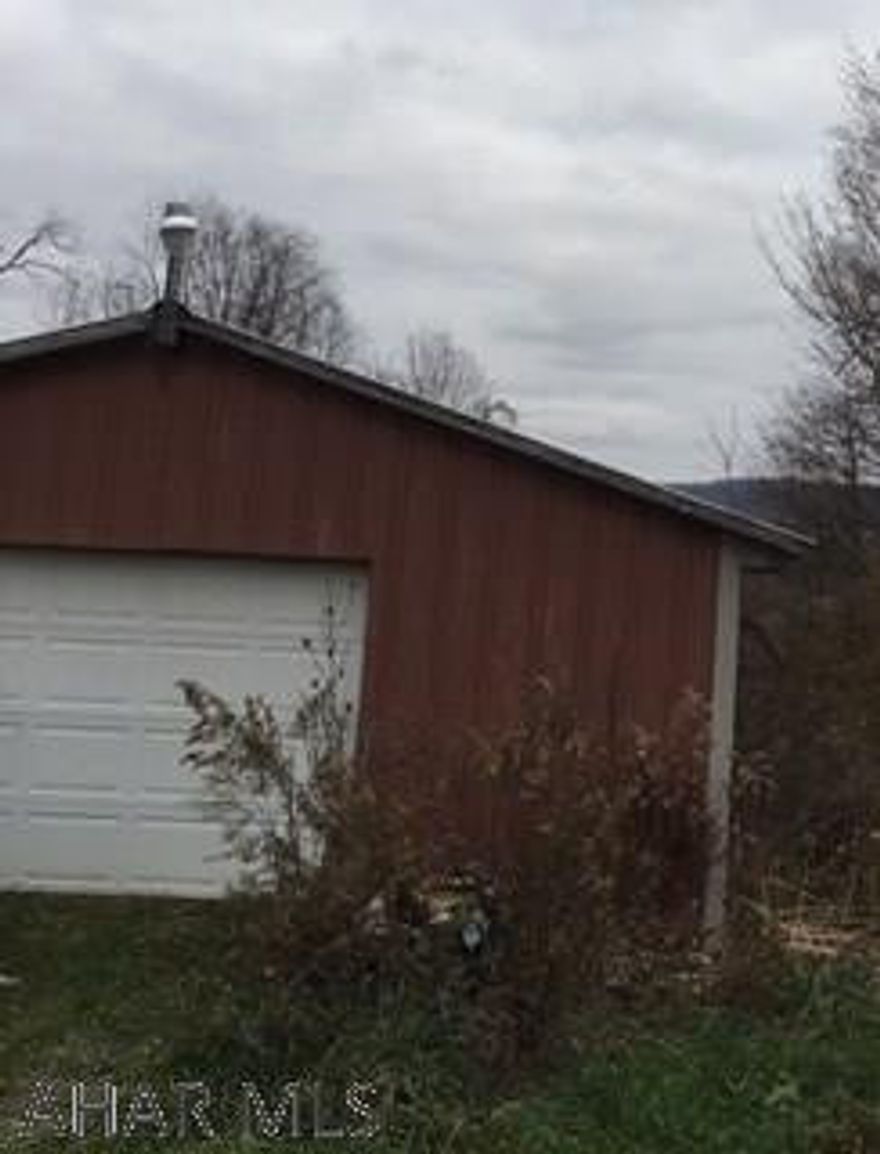 Land with garage, 2 mobile homes. Currently mobile homes can not be shown due to being in bad condition.