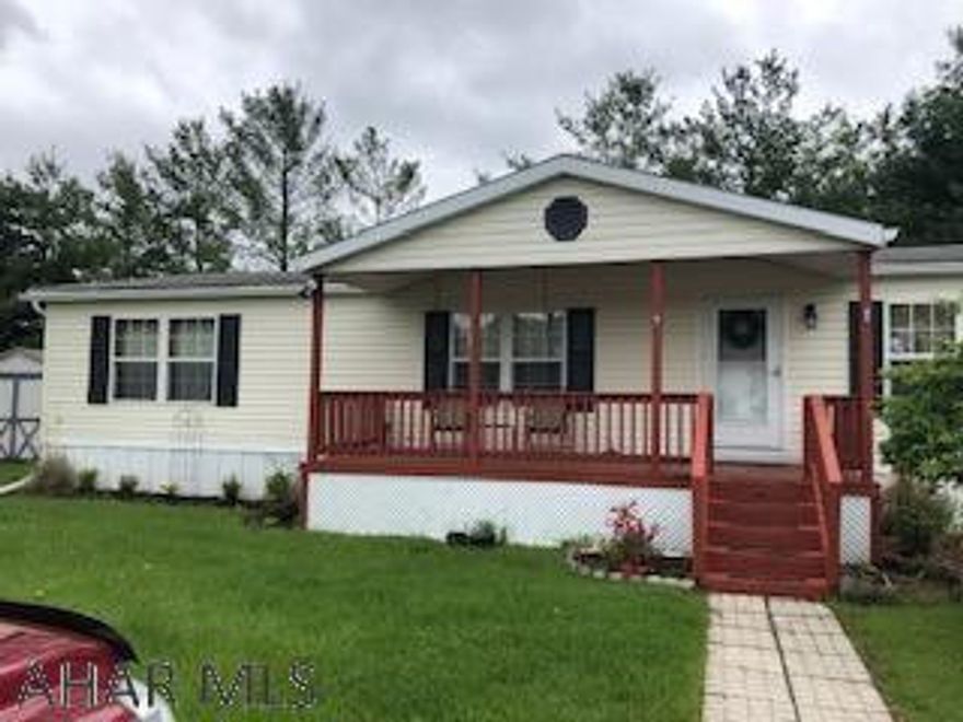 72x28 Doublewide with open floor plan, new laminate & carpet flooring in 2018.  Nice covered front porch & deck on side.  Kitchen appliance and shed included.  Gas FP in family room.  Lot Rent $392 per month includes trash & road maintenance.  Must be approved by Manager of Park to live at Independence - Park will be going age restricted in June.  Owner must be age 55 or older.