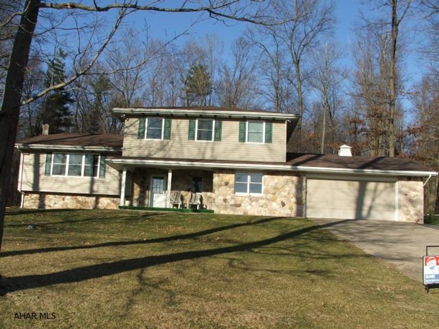 Solidly built, 4 bedroom split level on 2.38 acres. Spacious rooms, new kitchen w/quartz countertop. Updated throughout. 1 bedroom can be used as an office. OHW heat, 2 car attached garage. Private setting with great view.